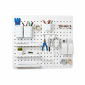 White wall-mounted pegboard organizer with hooks, shelves and bins